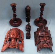 Mixed lot of carved Oriental wooden items including wall masks, busts, candlesticks etc All in