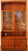Nathan style mid 20th century teak two door glazed wall unit. Approx. 193cm H x 102cm W x 46cm D