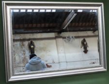 framed and bevelled wall mirror. Approx. 50 x 90 Reasonable used condition