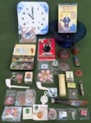 Sundry lot including blue and white ceramic clock, coloured glassware, playing cards, badges etc All