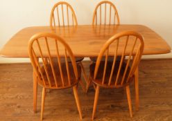 Ercol mid 20th century refectory style dining table with four stick back chairs
