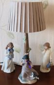 Nao figure form ceramic table lamp with shade, plus two other Nao glazed ceramic figures. Lamp