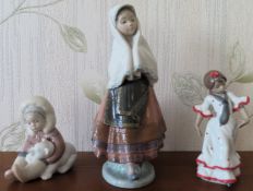 Three various Lladro glazed ceramic figures. Tallest Approx. 28cms Tallest damaged