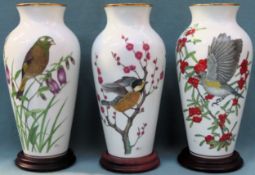 Three Japanese 'Ryu Okazaki' for Franklin Porcelain Limited Edition ceramic vases on wooden