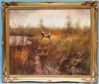 20th century gilt framed oil on canvas depicting pheasants in flight. Approx. 60 x 70cms