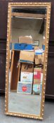 20th century gilded and bevelled rectangular wall mirror. Approx. 127 x 44cms reasonable used