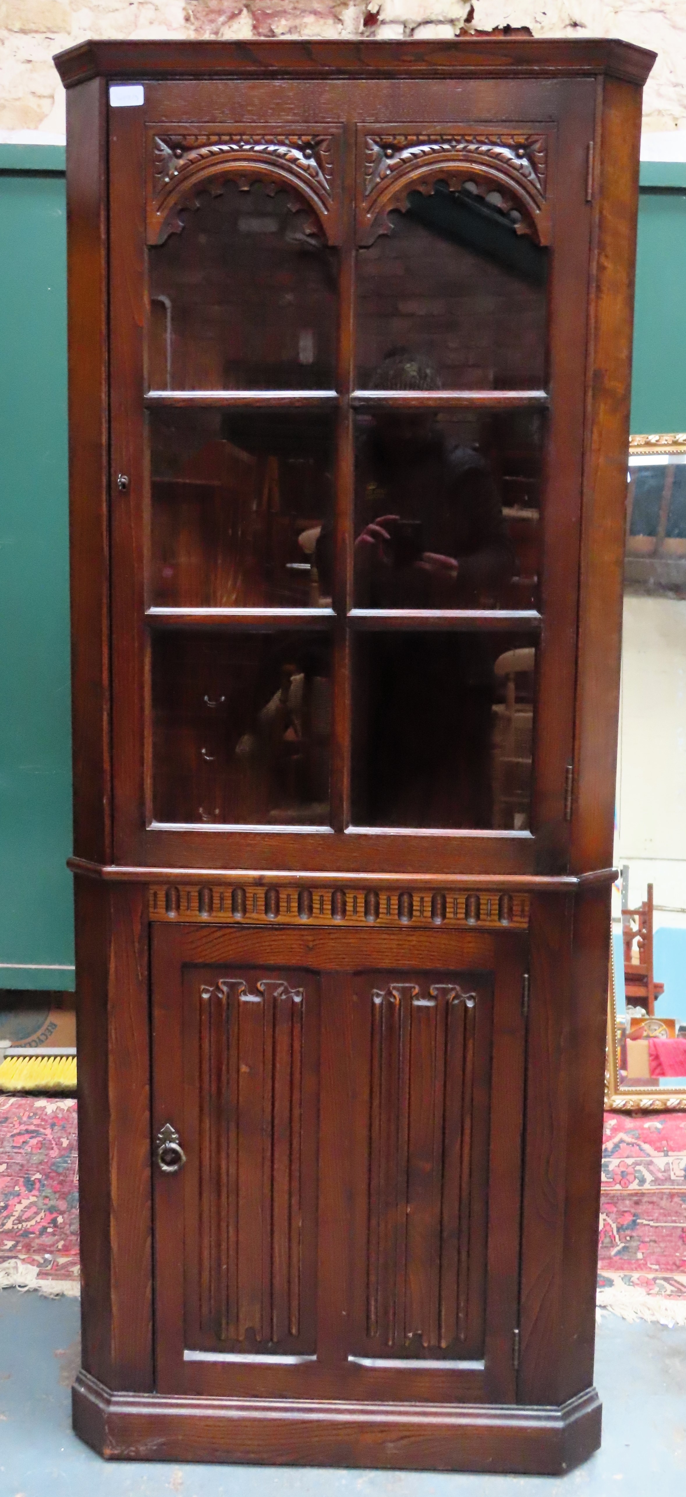 20th century carved oak single door glazed corner display cabinet. Approx. 176 x 70 x 40cms