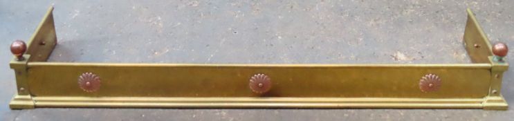 Decorative copper mounted brass fender. Approx. 19cm H x 123cm W x 31cm D Reasonable used condition