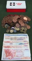 Quantity of various copper coloured coinage, vintage First Aid tin, plus foreign banknotes all