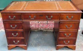 20th century seven drawer pedestal writing desk with leather effect insert. Approx. 75 x 121 x 61cms
