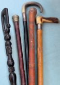 Two silver mounted horn handled walking sticks, African style ebonised stick, plus Oriental style