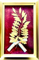 BOTANICAL REPRESENTATION IN GILDED METAL WITH RED, WHITE, BLUE RIBBON, GLAZED AND FRAMED