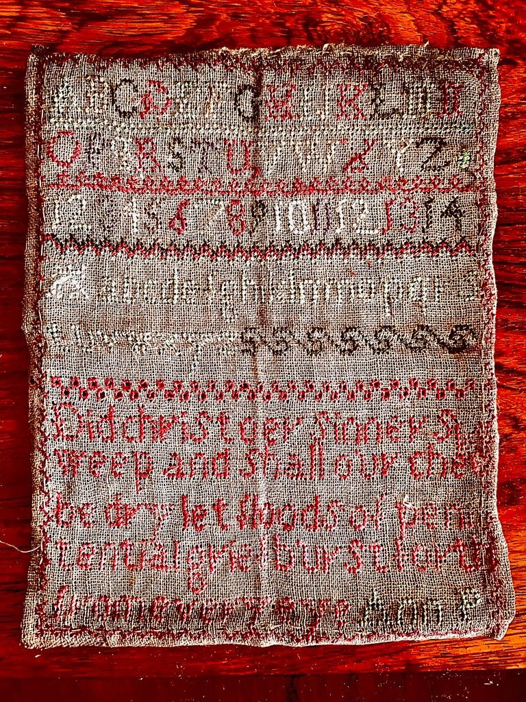 EARLY SAMPLER, DATE(?), WITH DISTRESSED FRAME, APPROX 24.5 x 20cm, ALSO EARLY GREETINGS CARD