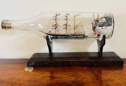SHIP IN A BOTTLE DIORAMA ON STAND, PENNANT BEARING NAME "INNIE"