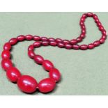 Large vintage strand of graduated Cherry Amber beads. Weight approx. 55.7g Reasonable used condition