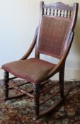 Early 20th century upholstered mahogany rocking chair. Approx. 95cm H x 50cm W x 70cm D Used