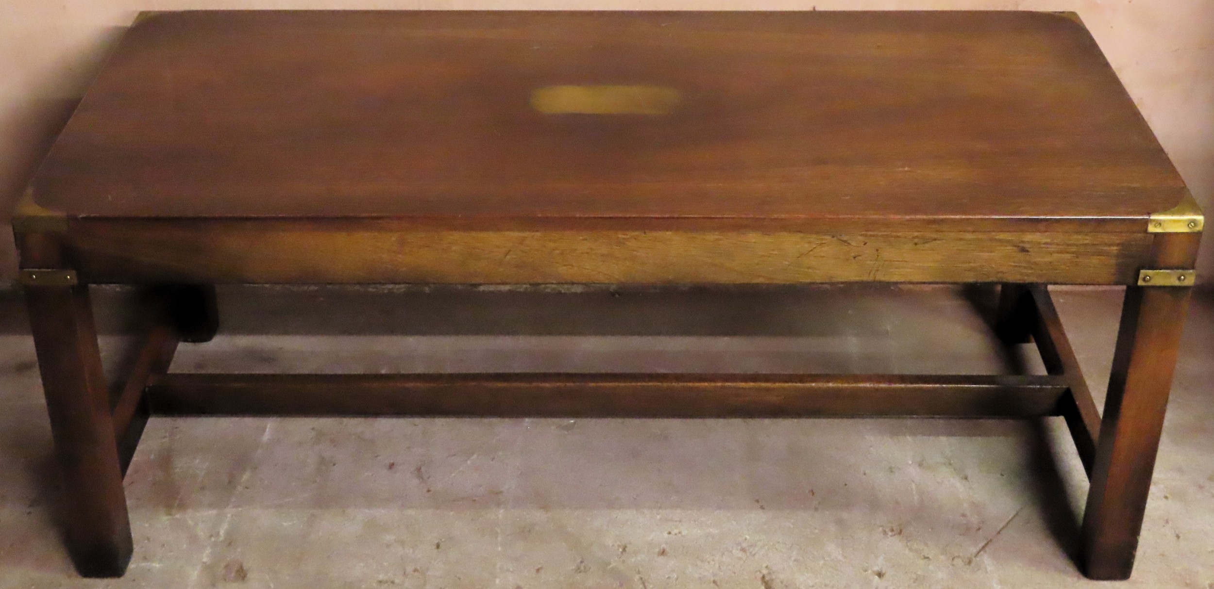 20th century campaign style brass bound coffee table on stretchered supports. Approx. 43cm H x 107cm