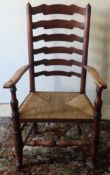 18th/19th century rush seated ladderback armchair. Approx. 113cm H Reasonable used condition, scuffs