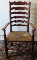 18th/19th century rush seated ladderback armchair. Approx. 113cm H Reasonable used condition, scuffs