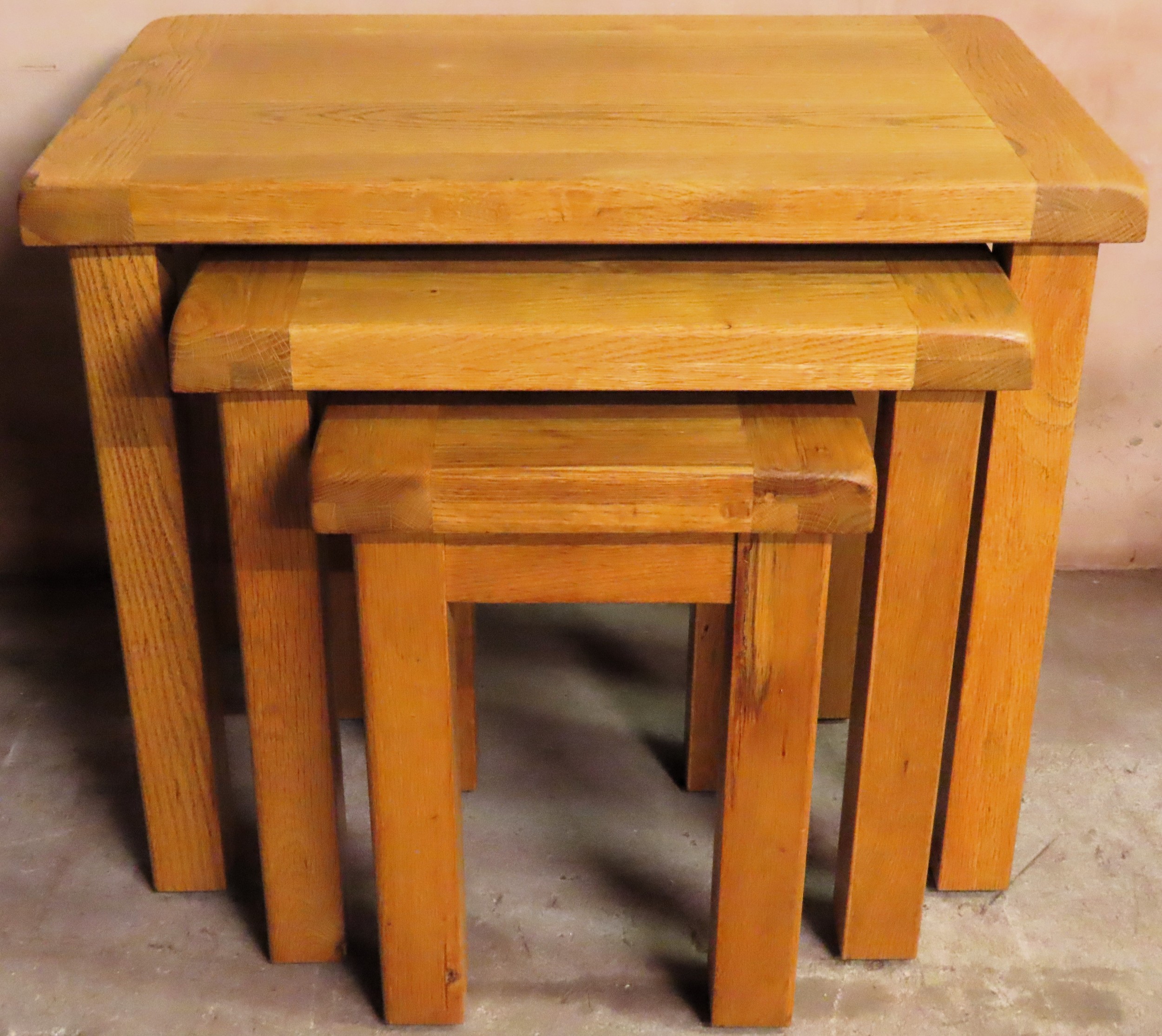 20th century solid light oak nest of three tables. Approx. 55cm H x 68cm W x 44cm D Reasonable