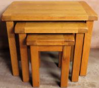 20th century solid light oak nest of three tables. Approx. 55cm H x 68cm W x 44cm D Reasonable