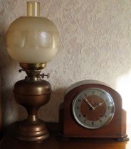 Copper and Brass oil lamp, plus oak cased mantle clock Both in used condition, not tested for