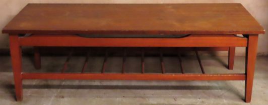 1970's teak coffee table on stretchered supports. Approx. 37cm H x 115cm W x 45cm D Used