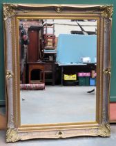 Large 20th century gilt framed and bevelled wall mirrors. Approx. 130cms x 104cms reasonable used