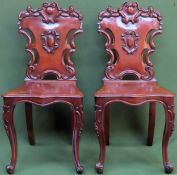 Pair of 19th century carved mahogany piercework decorated shield back hall chairs. Approx. 93cms H