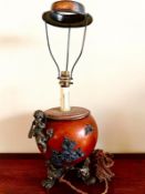 METALLIC GLOBULAR TABLE LAMP WITH APPLIED DECORATION UPON FOUR SCROLL SUPPORTS, APPROX 50cm HIGH