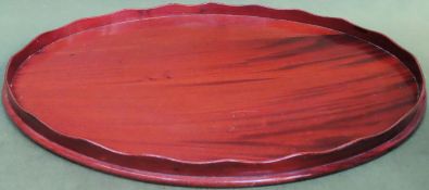 19th century large oval mahogany wave edged serving tray. Approx. 72cms x 51cms