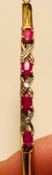 8ct GOLD HOLLOW BANGLE SET WITH FOUR RUBIES, EACH BEING APPROX 0.2ct, PLUS BRILLIANTS