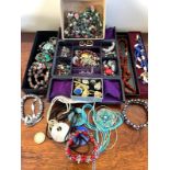 LARGE QUANTITY OF COSTUME JEWELLERY INCLUDING EARRINGS, AMBER BEADS AND BRACELETS, ETC.