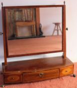 Large Edwardian mahogany bowfronted three drawer dressing table mirror, with brass ball and claw