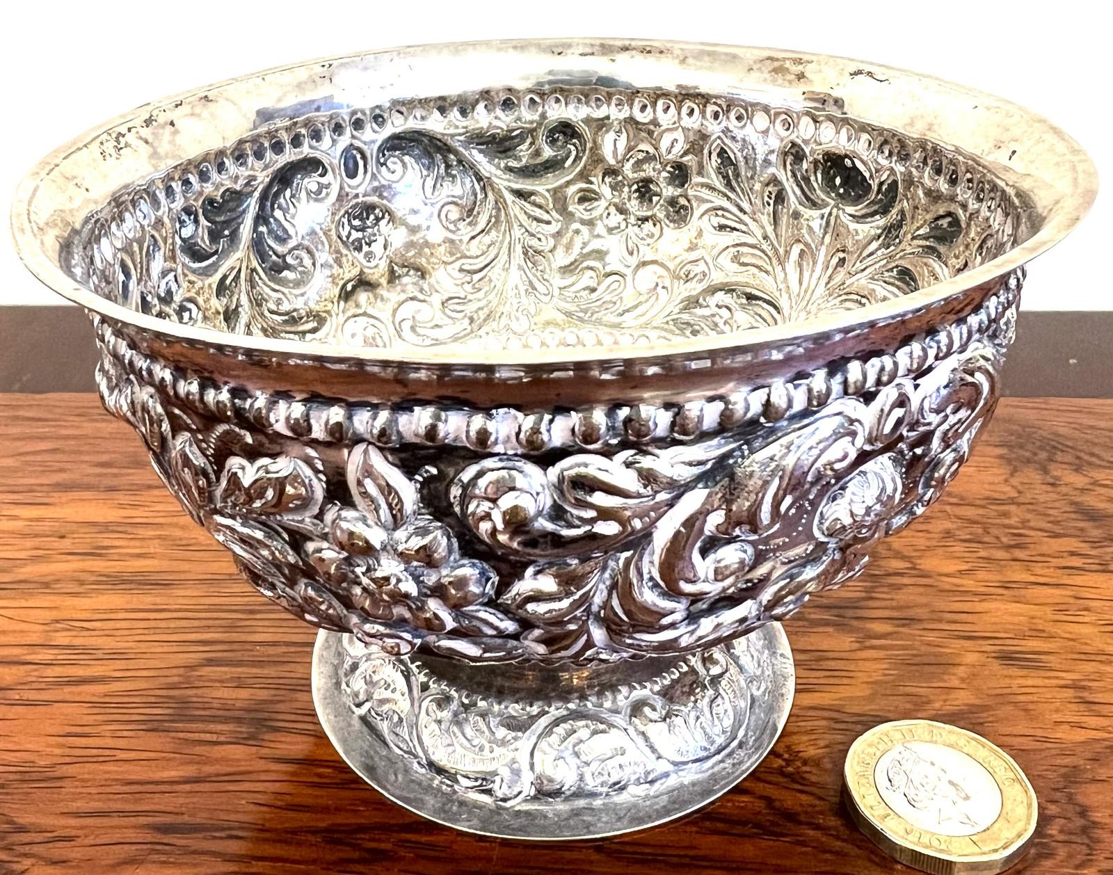 INDIAN WHITE METAL BOWL UPON RAISED FOOT, APPROX WEIGHT 120g. APPROX. 8CM HIGH & DIAMETER 12.5cm