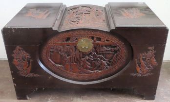 Heavily carved Oriental Camphor chest. Approx. 59cm H x 102cm W x 51cm D Used condition, scuffs