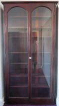 Large 20th century mahogany two door bevelled and glazed bookcase. Approx. 220cm H x 115cm W x