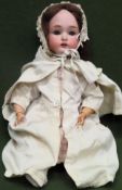 Early 20th century porcelain headed jointed doll with hand painted features. Approx. 44cms H used