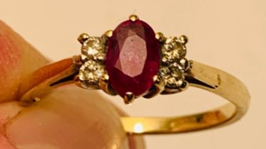 9ct GOLD DRESS RING SET WITH ONE RUBY APPROX 0.7ct, AND FOUR DIAMONDS APPROX 1.4ct