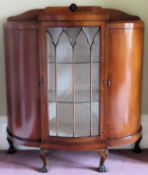 Art Deco Walnut veneered serpentine fronted single door glazed display cabinet