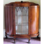 Art Deco Walnut veneered serpentine fronted single door glazed display cabinet