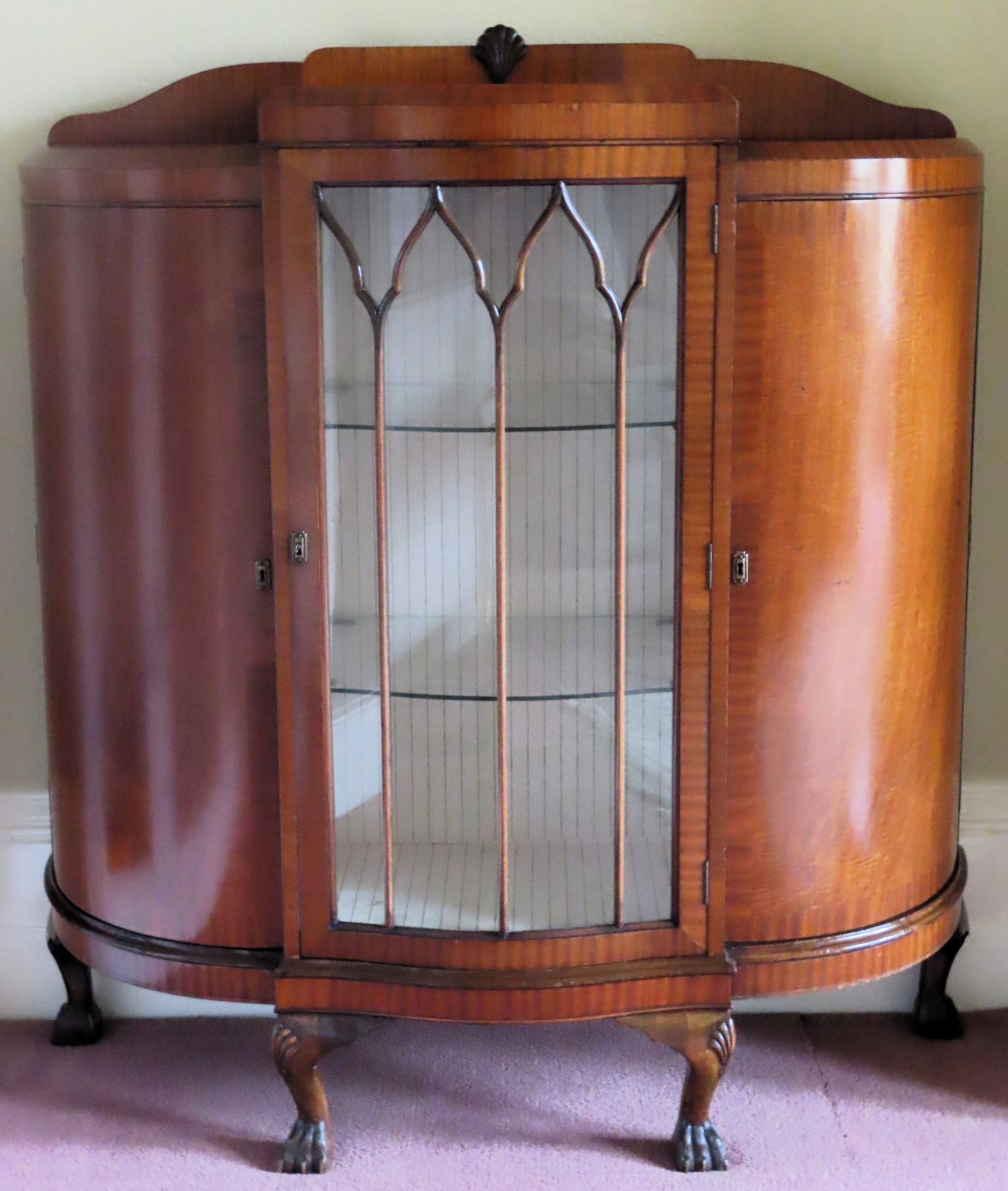 Art Deco Walnut veneered serpentine fronted single door glazed display cabinet