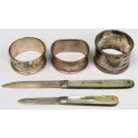 Three various hallmarekd silver napkin rings, plus two silver mother of pearl penknives