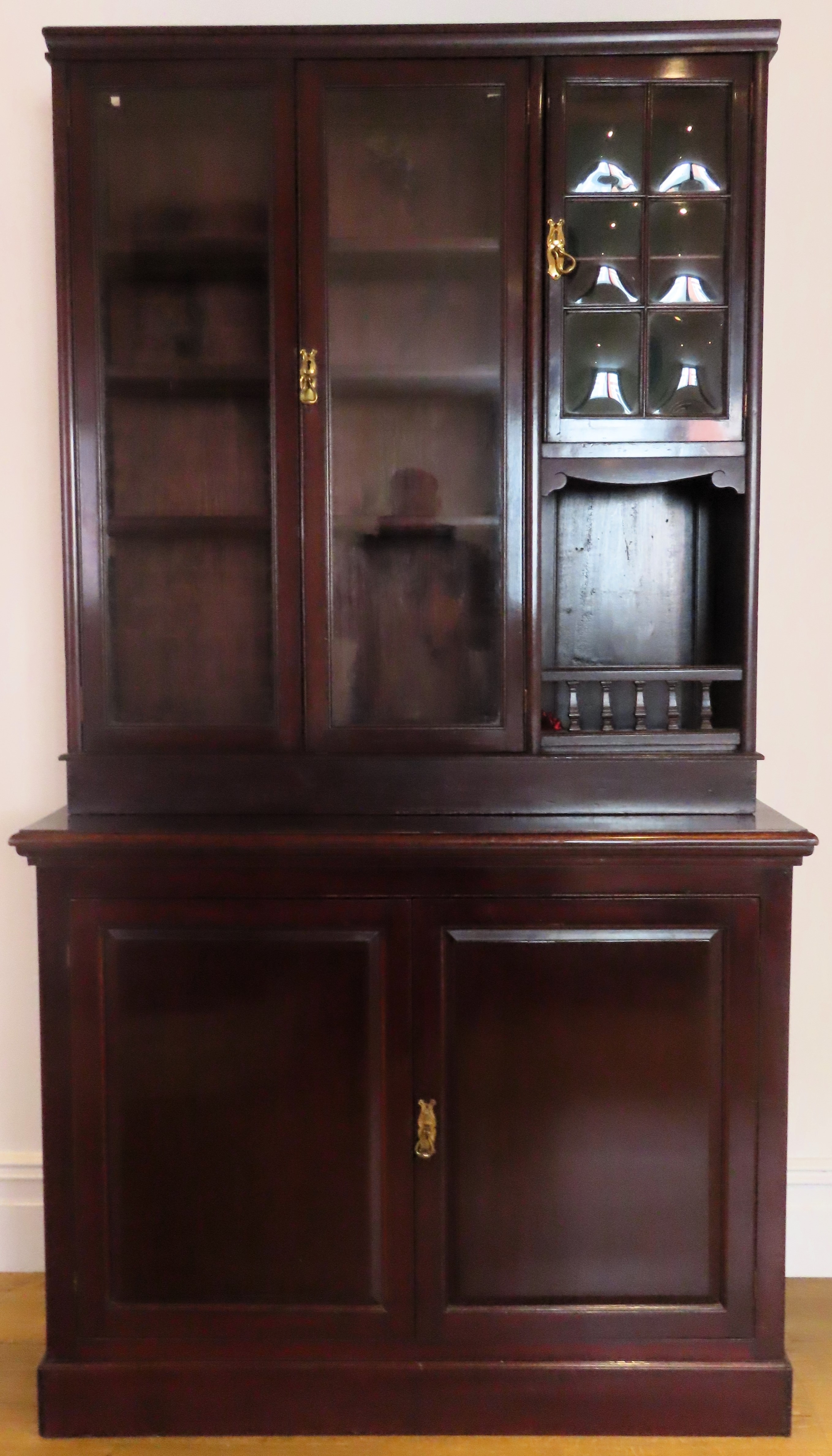 20th century mahogany glazed wall unit with cupboard doors below. Approx. 209cm H x 117cm W x 44cm D
