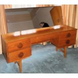 1970's inverted bowfronted teak single drawer dressing table. Approx. 110cm H x 150cm W x 41cm D