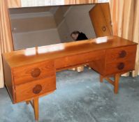 1970's inverted bowfronted teak single drawer dressing table. Approx. 110cm H x 150cm W x 41cm D