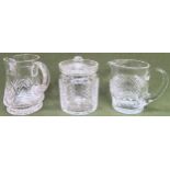 Waterford crystal jug, another glass jug, plus glass biscuit barrel with cover