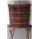 Small walnut veneered serpentine fronted chest of four drawers. Approx. 73cm H x 41cm W x 36cm D