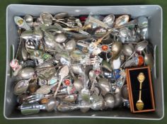 Large quantity of various enamelled and silver plated souvenir spoons