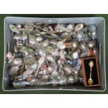 Large quantity of various enamelled and silver plated souvenir spoons